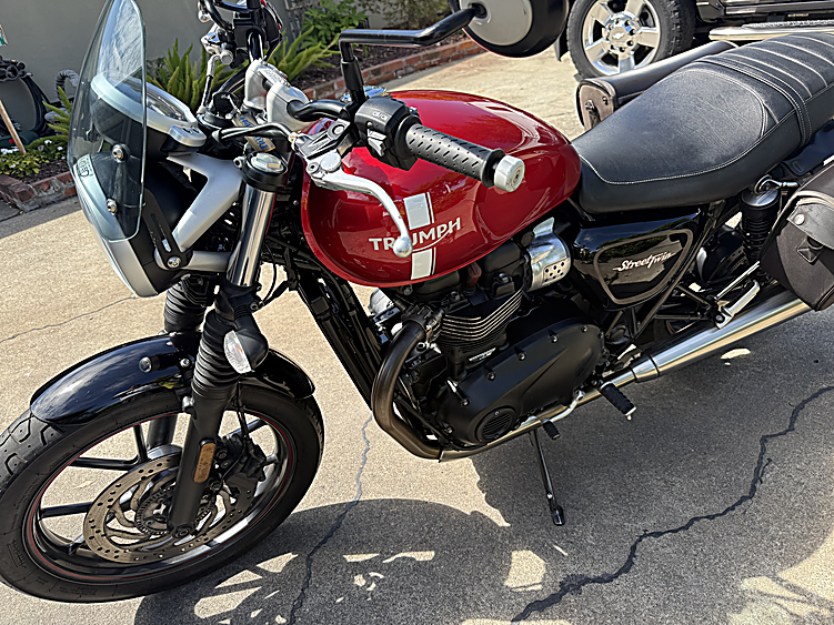 Red Triumph Street Twin with polished chrome after detailing