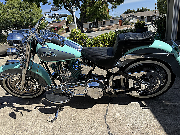 Turquoise Harley-Davidson Heritage Softail with whitewall tyres after detailing