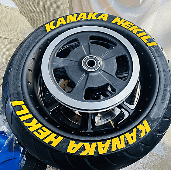 Motorcycle wheels with custom yellow tire lettering
